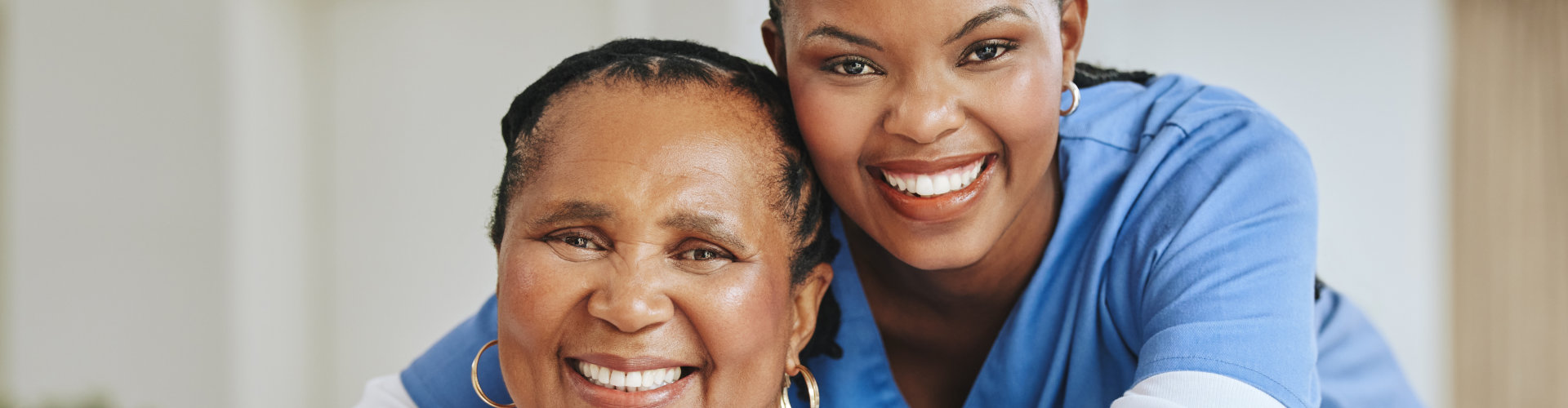 caregiver and woman smiling