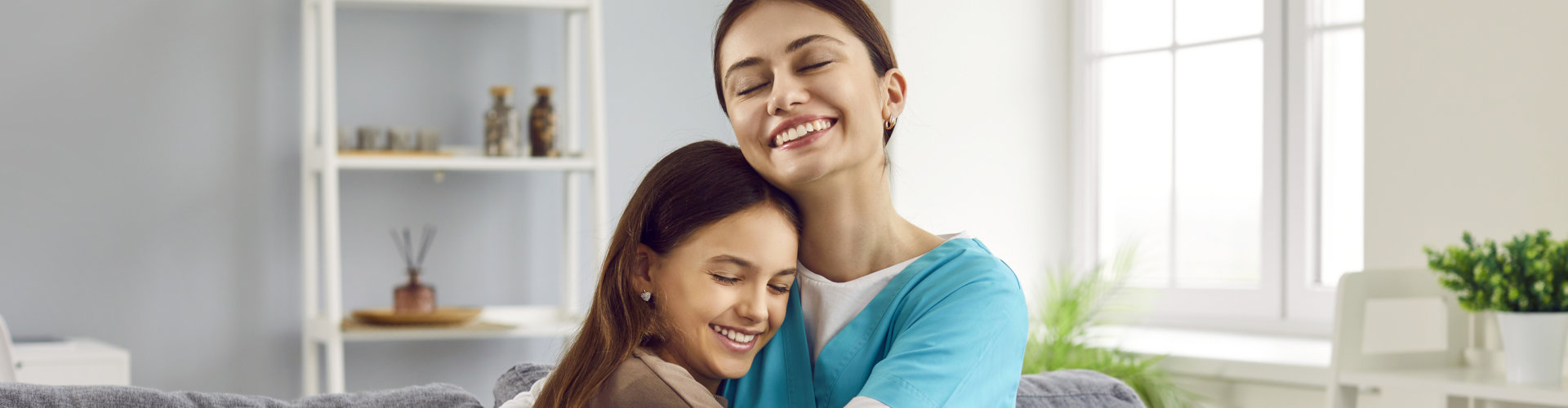 caregiver hugging a patient